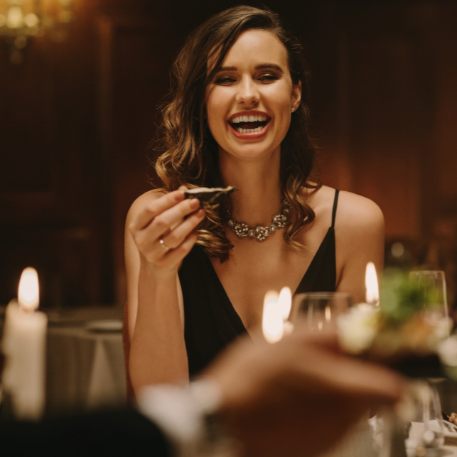 Image of a women holding an oyster